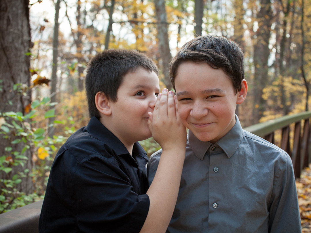 Brothers telling jokes during a kids portrait session